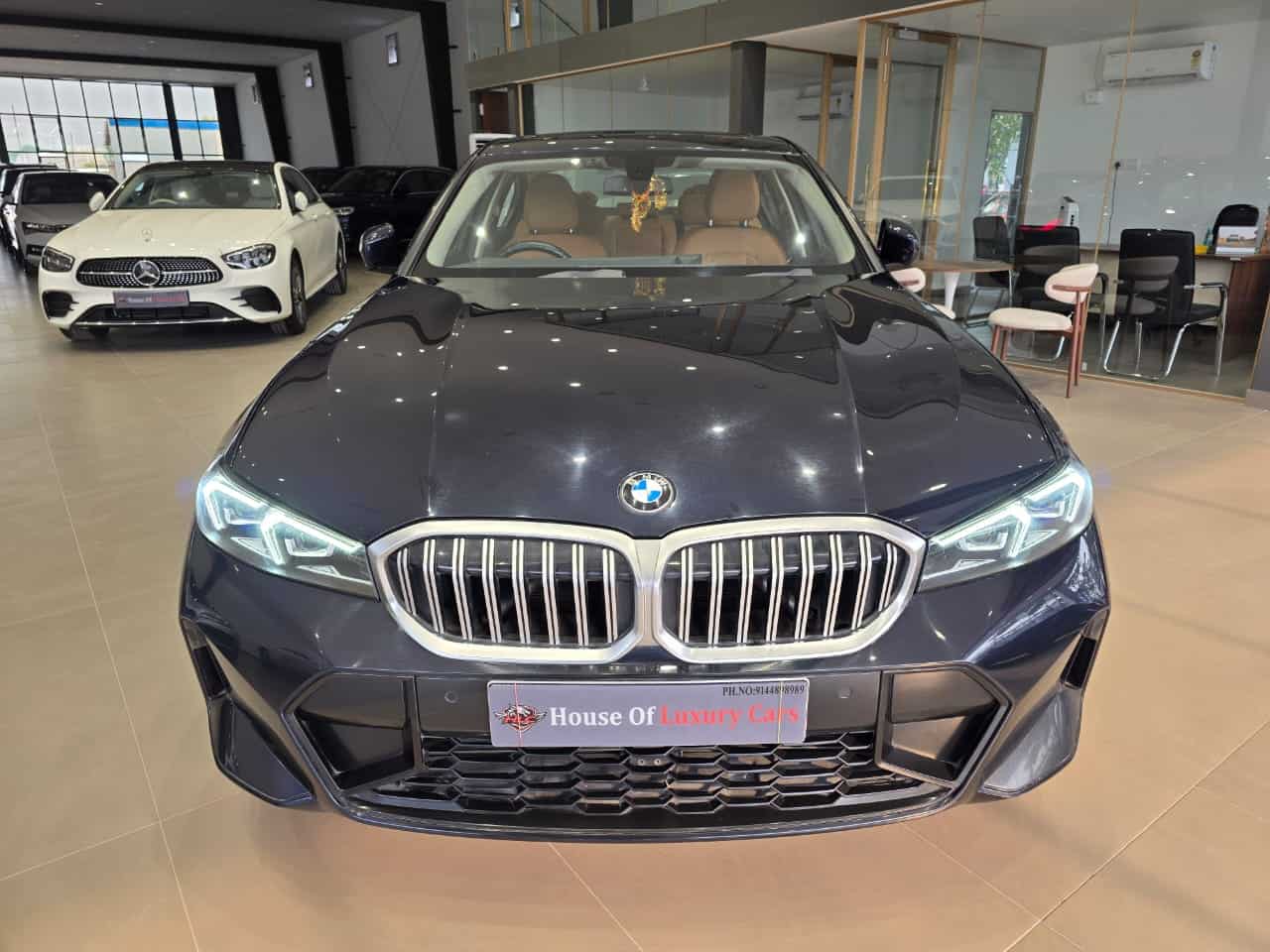 BMW 330Li on the House of Luxury Cars showroom floor in Madhapur